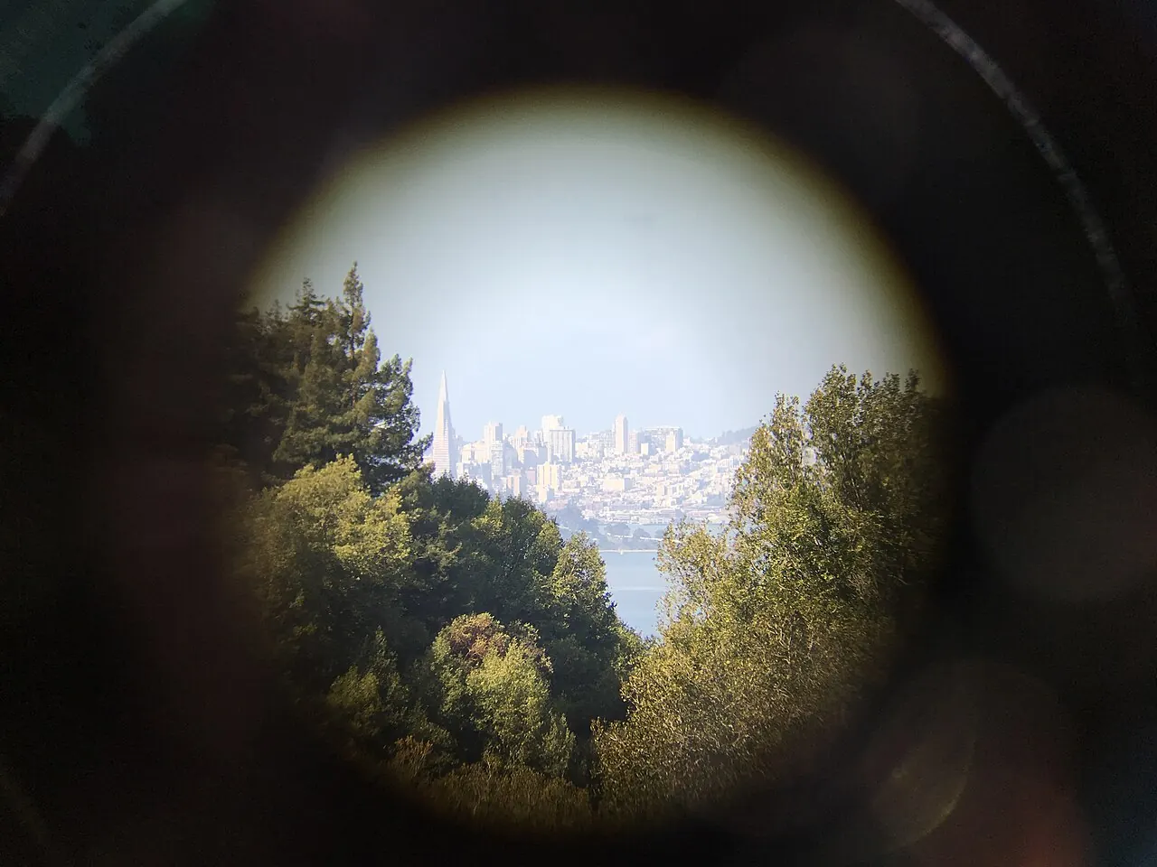 Berkeley – Berkeley, California: San Francisco as seen through binoculars shot on a cellphone from Berkeley California